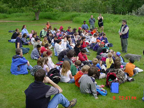 Group of children sitting on the grass